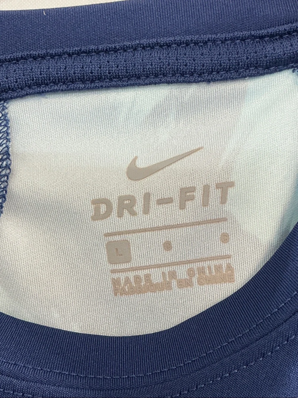 Nike Men’s Navy Tank Top with Light Blue Swoosh and Patterned Side Panels